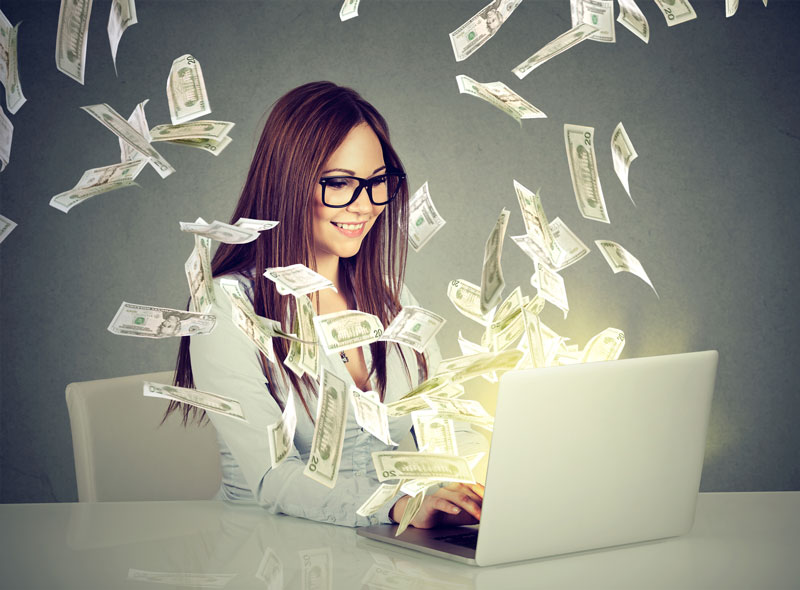 Woman on computer with money